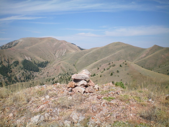 The summit cairn atop Peak 8881, with Peak 9660 (left of center) and Peak 9201 (right of center) in the background. Livingston Douglas Photo 