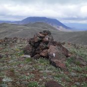 The summit cairn atop Peak 8297 South with Peak 8297 North in the background. Livingston Douglas Photo