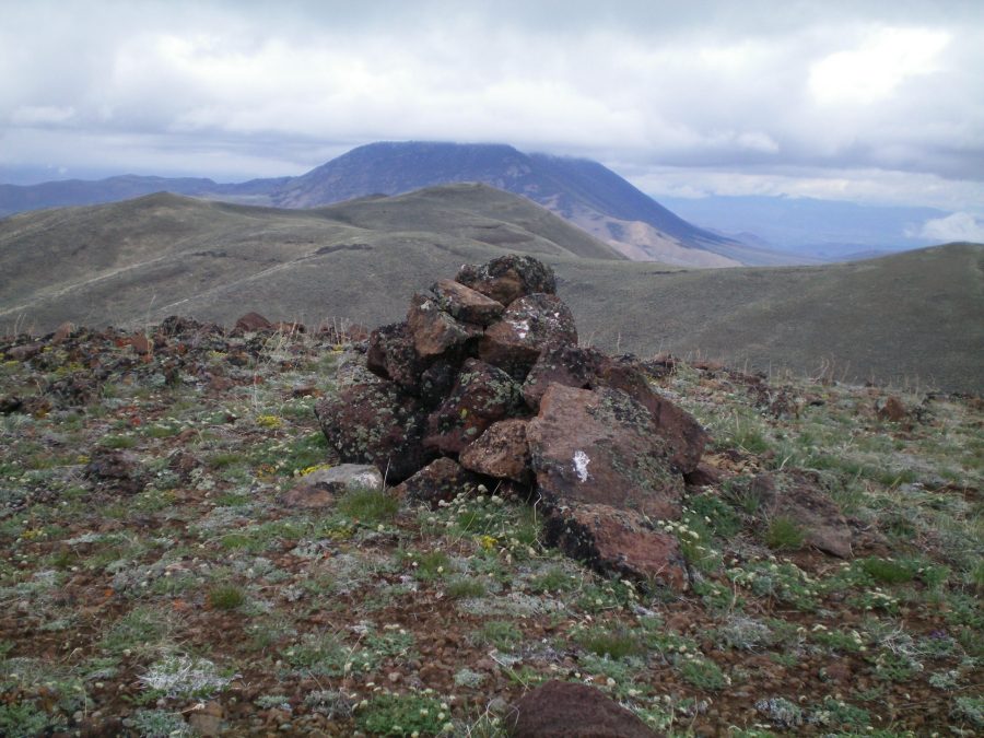 The summit cairn atop Peak 8297 South with Peak 8297 North in the background. Livingston Douglas Photo