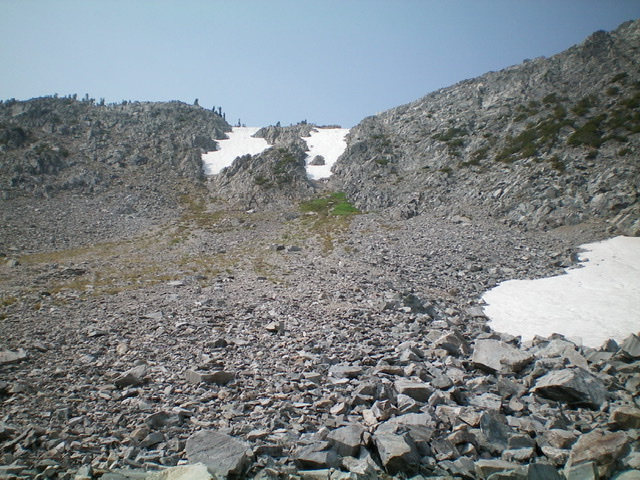 The permanent snow-filled couloirs on the north side of the Ajax Peak/Don Moore Peak saddle. Climb up the arete on the left side of the leftmost couloir (Class 3) to reach the saddle. Livingston Douglas Photo 