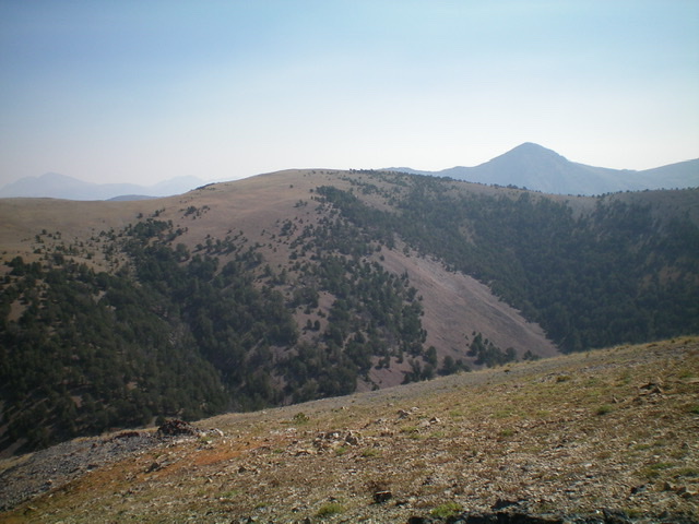 The newly-built summit cairn atop Peak 10077 with rugged Dianes Peak (10,404 feet) in the background. Livingston Douglas Photo 