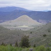 Cedar Mountain as viewed from the southwest on a high ridge. Rattlesnake Peak is in the foreground and Old Tom Mountain is partially cloud-covered and is in the background. Livingston Douglas Photo