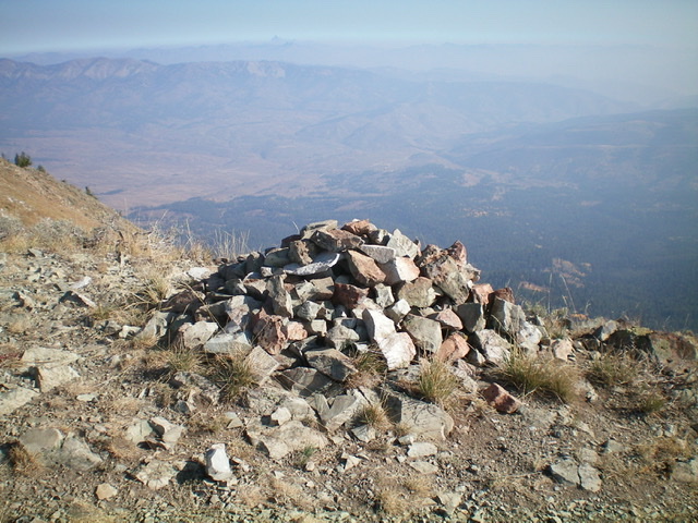  The large [somewhat-flattened] summit cairn atop Caribou Mountain. Pic #995: Looking up the south ridge of Caribou Mountain from high on the ridge. The summit hump is left of center. Livingston Douglas Photo 