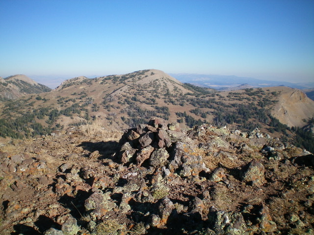 The summit cairn atop Peak 9500, looking northwest. Peak 9584 is in the distance (dead center). Livingston Douglas Photo 