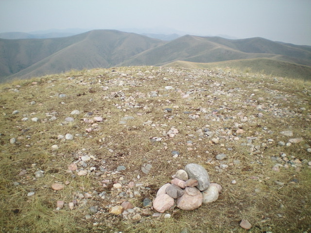 The summit area of Peak 8860, looking back at Peak 8871 to the west in the distance (left of center). Livingston Douglas Photo 