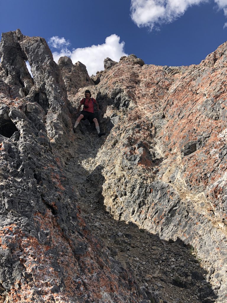 Daniel Todd descending the crux. Derek Percoski Photo