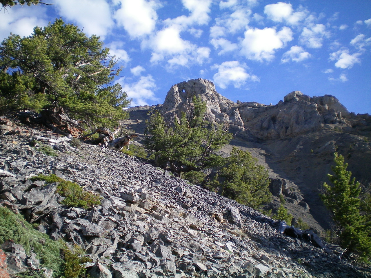 A view of the “window rock” on the [lower] Southwest Summit of Medusa, as viewed from the Southeast Shoulder. Livingston Douglas Photo 