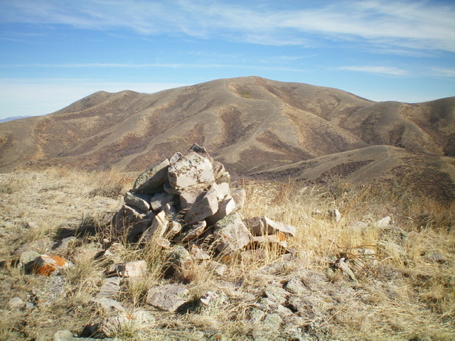 The large summit cairn atop Peak 6770, with Quaking Aspen Mountain in the background. Livingston Douglas Photo 