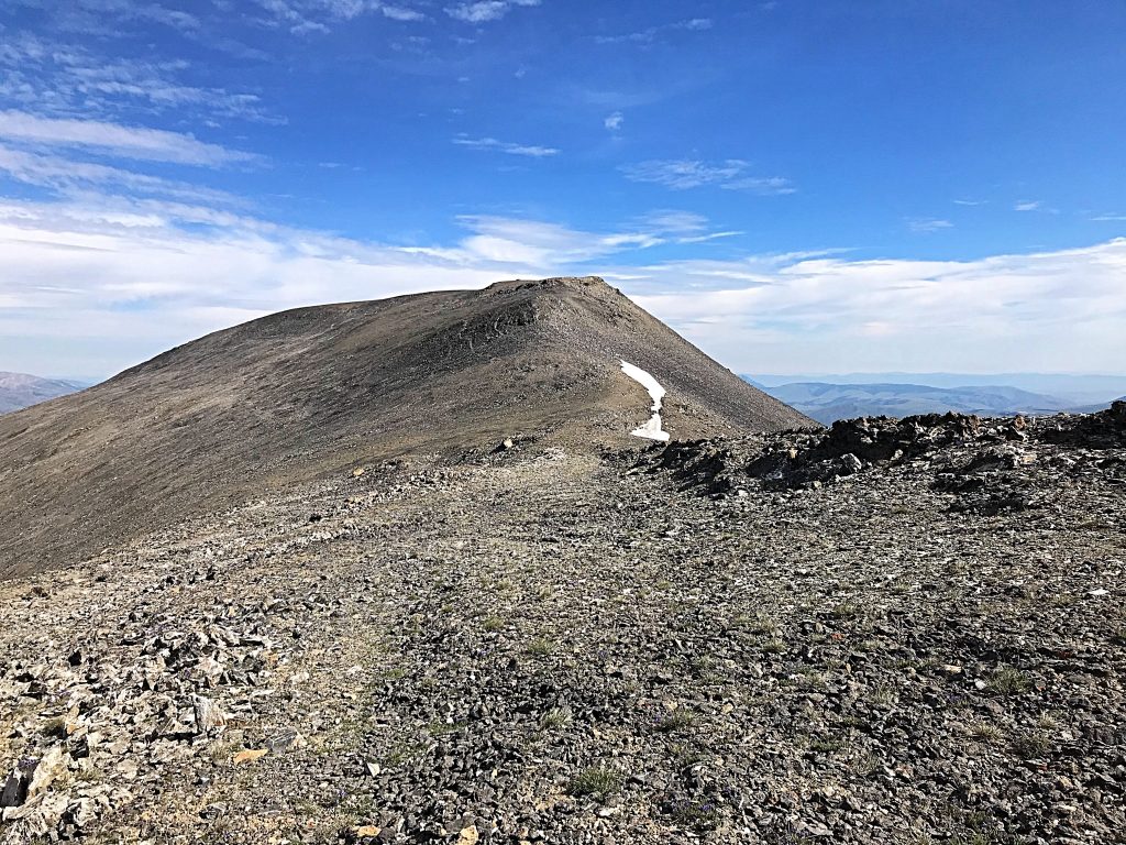 The summit of Scott Peak viewed from the top of the Tower Rib. Scott Peak’s summit ridge is nearly a mile long. The southern end of the ridge encompasses Webber Peak and the Clark County High Point.