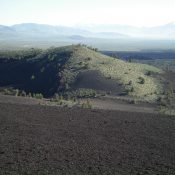 The East Face of Big Craters as viewed from the summit of Inferno Cone. The craters are on the far side of the hillside shown on the photo. The summit high point is just behind the trees, on the East Rim. Livingston Douglas Photo