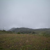 View of the true summit of Howard Mountain, which is to the left and has only one [albeit very tall] antenna. Photo taken from Point 5833. Livingston Douglas Photo