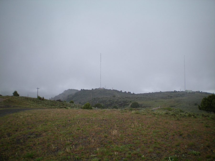 View of the true summit of Howard Mountain, which is to the left and has only one [albeit very tall] antenna. Photo taken from Point 5833. Livingston Douglas Photo