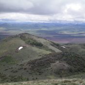 The summit of Peak 6708 as viewed from the top of Peak 6910. The forested hump in the lower right is Point 6550. The summit is left-of-center, farther away, and is mostly in open terrain. Livingston Douglas Photo