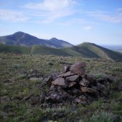 The summit cairn atop Peak 6326 with Pine Mountain in the distance (left) and Peak 6331 in the middle with its LONG Northeast Ridge. Livingston Douglas Photo