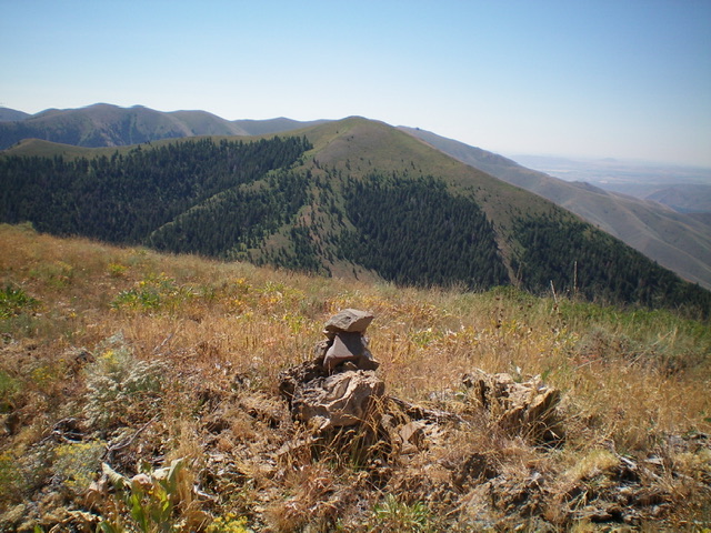 The newly-built summit cairn atop Peak 8120 with Peak 8189 in the distance