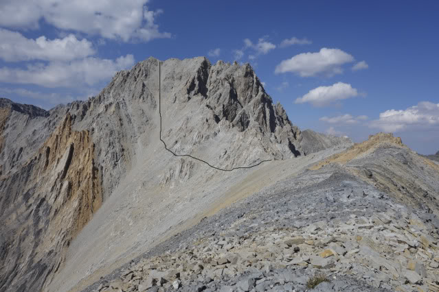 The descent routown to the level of the big saddle and then crosses over. 'This chute is begging for a ski descent, probably a first ski descent from the mountain. Spring is coming!