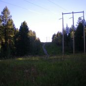 Looking north up the powerline service road as it climbs the south ridge of Peak 5950. The summit is to the left of the road's high point dead ahead. Livingston Douglas Photo