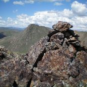 The summit cairn atop Peak 6541. Rugged Peak 6684 is in the background, just left of the cairn. Livingston Douglas Photo