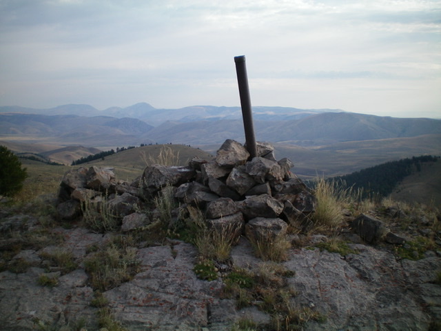 The summit cairn and ID/MT boundary post atop Peak 8980, looking north. Livingston Douglas 