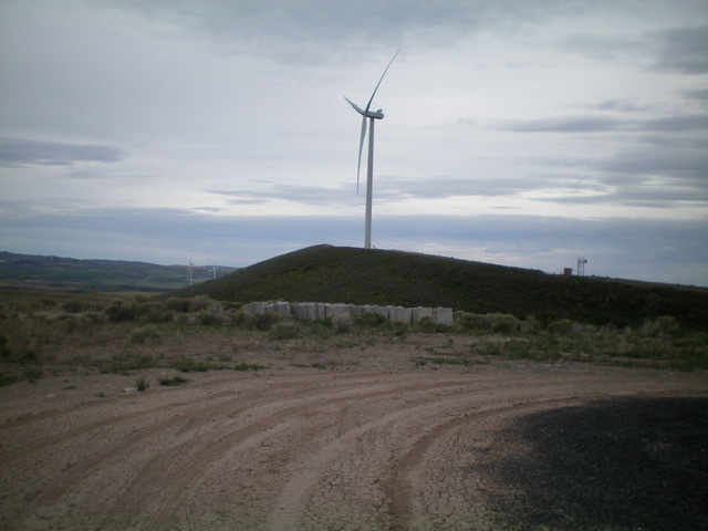 Big Horse Butte and its windmill as viewed from Little Horse Butte to its east. Livingston Douglas Photo 
