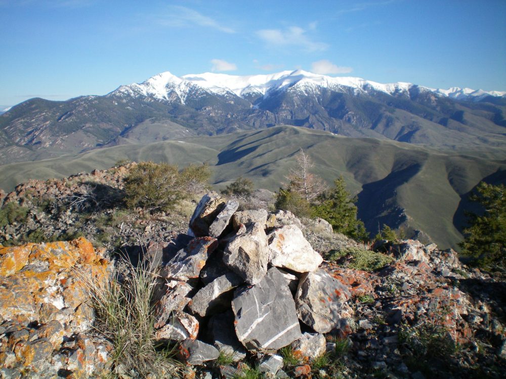 The summit cairn atop Peak 8170 with snow-covered King Mountain and North King Mountain in the background. Livingston Douglas Photo 