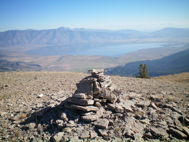 The summit cairn atop Peak 9584 with beautiful Henrys Lake in the background. Livingston Douglas Photo 