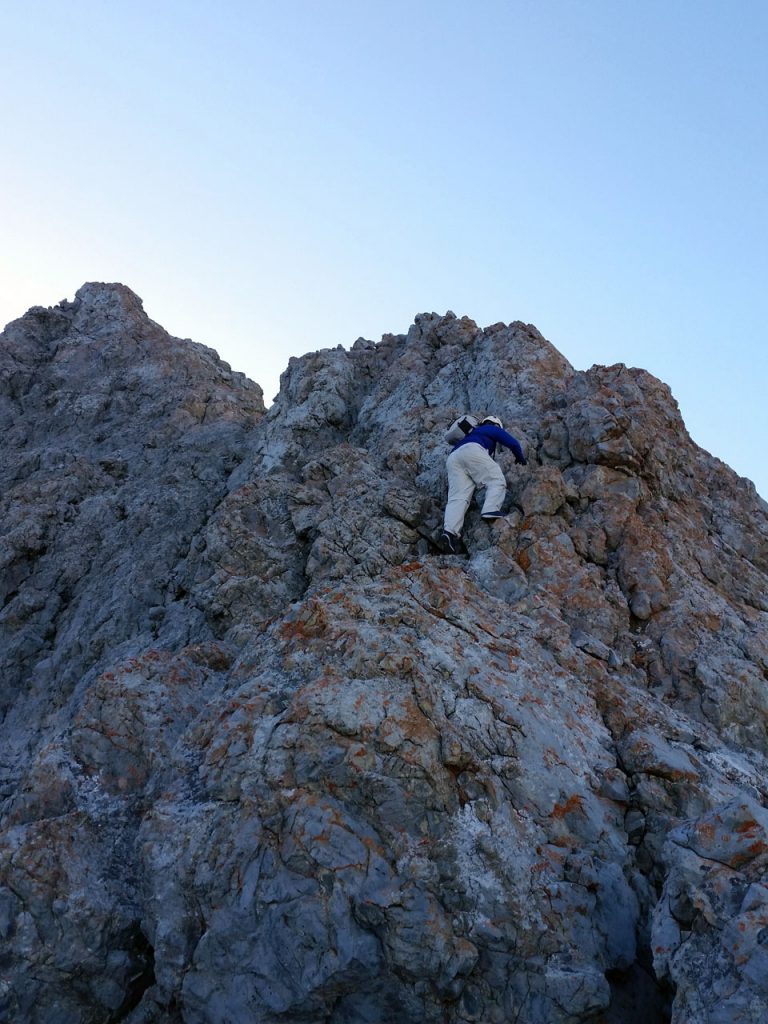 Kevin Hansen scrambling up the apron just above tree line. Thierry Legrain Photo 