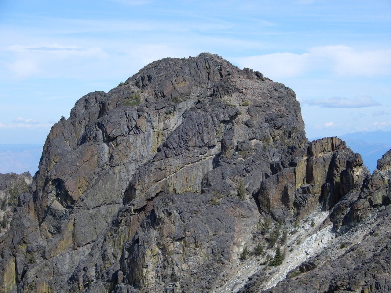 The south ridge melds into the peak’s south face. Climbing the face is the crux. John Platt Photo 