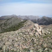 Peak 9877 (bare hump, left of center) with Copper Mountain in the background, as viewed from the summit of Gallagher Peak. Livingston Douglas Photo