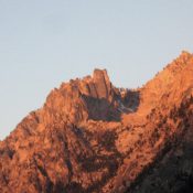 Early-morning alpenglow on the Grand Aiguille, at center of photo. Ray Brooks Photo