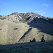 Peak 8923 (summit is in dead center) as viewed from a hillside to its Southeast. The left skyline is the upper half of the South Ridge. Livingston Douglas Photo