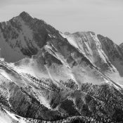 The Northwest Ridge is in the center of the photo. This ridge branches into two separate ridges lower down on the mountain, one into the Rock Creek drainage and the other forms the edge of the West Face. The Southwest (Chicken-Out) Ridge is on the right skyline. Photo by John Platt