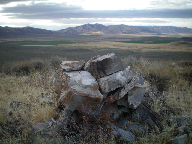 The summit cairn atop Peak 5380 with the North Hansel Mountains in the distance. Livingston Douglas Photo 