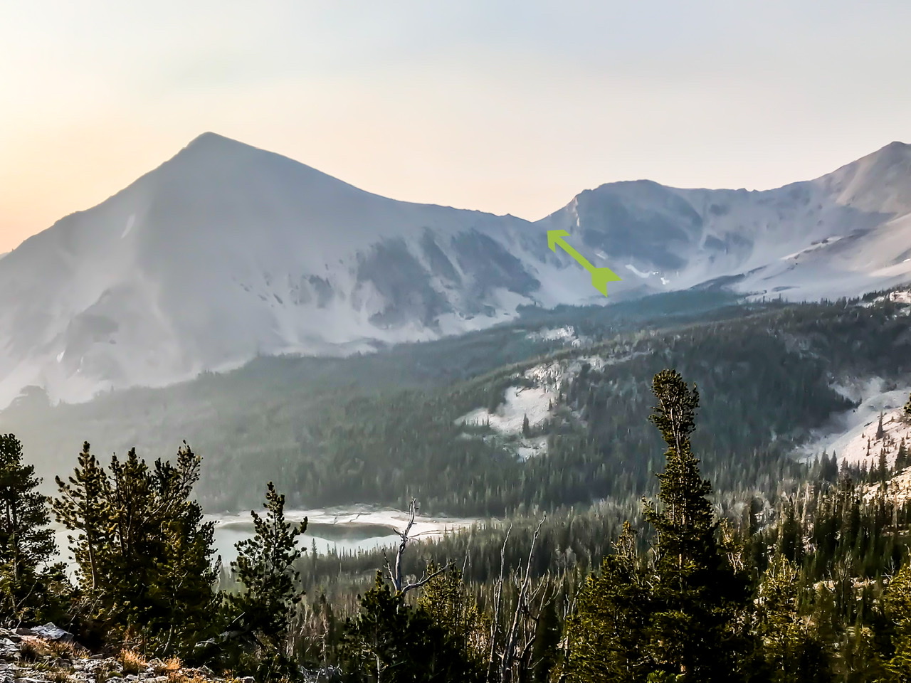 The green arrow shows the gully which leads to the col between The Wedge and The Ledge. The Wedge is on the left. The Ledge is out of sight to the right.