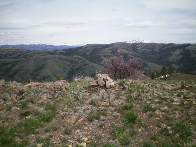 The newly-built summit cairn atop Mahogany Ridge with the snow-clad Tetons in the distance. Livingston Douglas Photo 