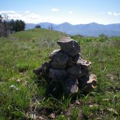 The summit cairn atop Peak 7405 with the [lower] East Summit hump behind, and left of, the cairn. Livingston Douglas Photo