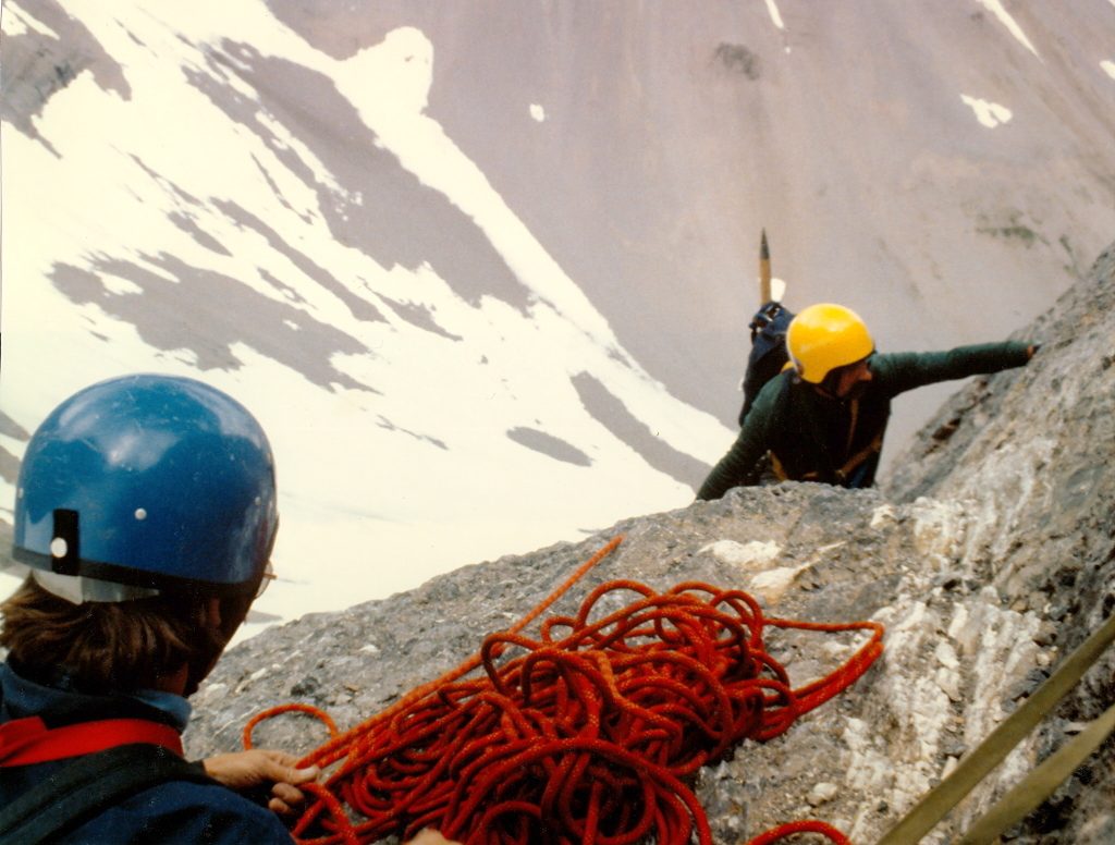 Mike topping out at the marginal belay spot. Photo - Curt Olson