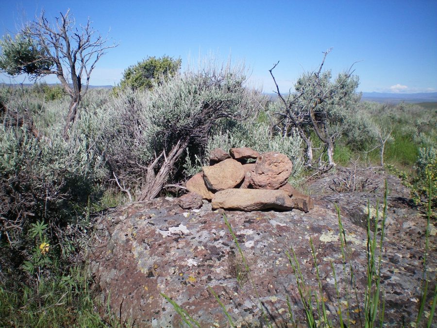 The summit cairn atop Clay Bank Hills HP with the ever-present thick sagebrush nearby. Livingston Douglas Photo