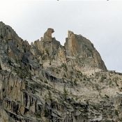 The South-East-face of Fishhook Spire, at top center.  Becky route follows line of weakness to notch, at right of hook, then goes behind the spire. Ray Brooks Photo