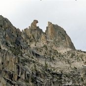 The South-East-face of Fishhook Spire, at top center. Becky route follows line of weakness to notch, at right of hook, then goes behind the spire. Ray Brooks Photo