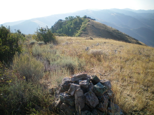 The nice summit cairn atop Peak 7100, looking southeast at Point 7040+. Livingston Douglas Photo 