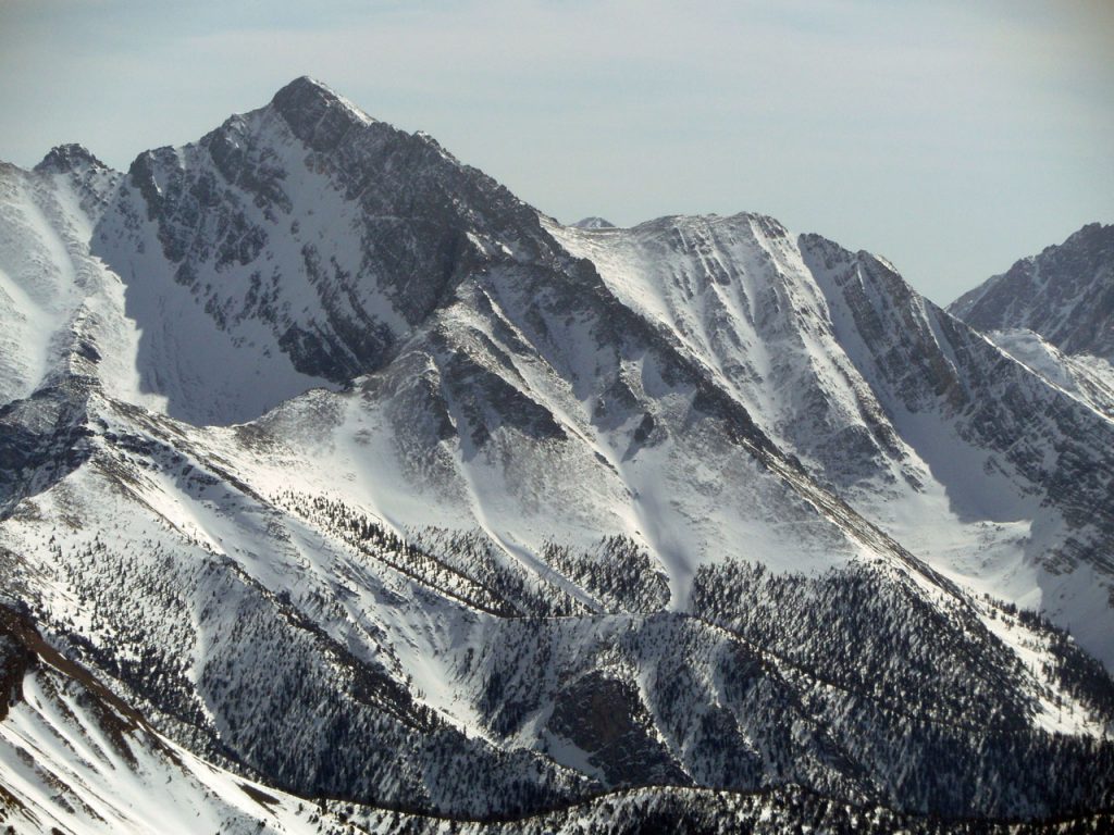 The northwest ridge rising from bottom right to upper left. Chicken out ridge is in the background. Mike climbed the left (east) spur while Vaughn Howard climbed the right (west), meeting at the Y. Both spurs rise up from Rock Creek and are very prominent when viewed from the right location. The east spur overlooks the NF where the west spur keeps COR ridge in view. John Platt Photo