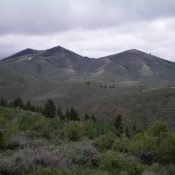 The undulating ridge line of Peak 6910. The double-humped summit is just left of center. The Left/West summit is the high point. Livingston Douglas Photo