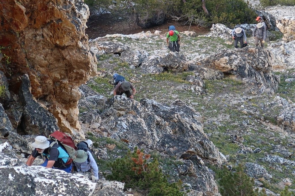 Scrambling up the lower north side of the step. Clint Barg Photo 