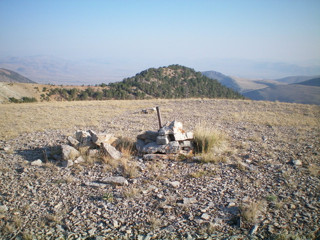 The summit of Reentrant Peak with forested Point 10007 in the background. Livingston Douglas Photo 