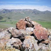 The summit cairn atop Rocky Butte, looking NW across the ranch land of Gilman Flat. Livingston Douglas