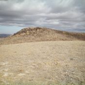 Buck Peak's hidden, rocky summit (left of center) only comes into view when atop Point 6373 to its south. Livingston Douglas Photo