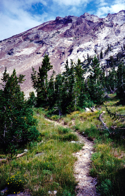 Rick Baugher reports that this shot is of "the East Fork Wood River trail just before it switchbacks right to gain the predipitous Johnstone Pass. Straight ahead is the The Box on the Pioneer crest. The upper section of the Southwest Rib Route is on the left skyline. Part of the serrated Box-Johnstone Pass ridge is also visible." Rick Baugher Photo