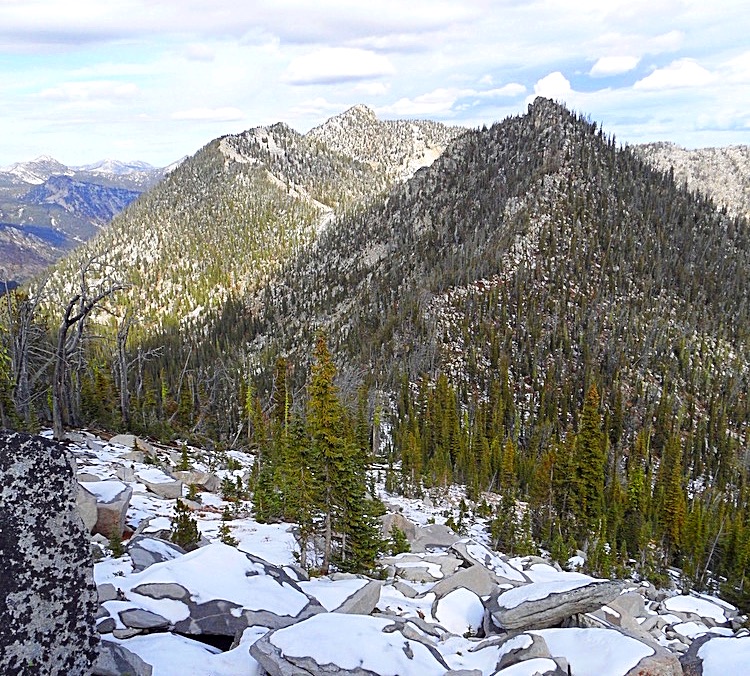The central Lick Creek crest, east of Payette Lake is rugged and remote. This photo taken from Bearpaw Peak shows the crest from Rainbow Peak to Nick Peak (just to the left andmway in the distance). John Platt Photo 