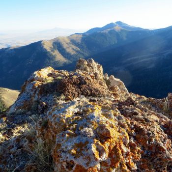 The summit of Peak 8037 with a view of Goodenough Peak in front of Old Tom Mountain. Photo - Steve Mandella.